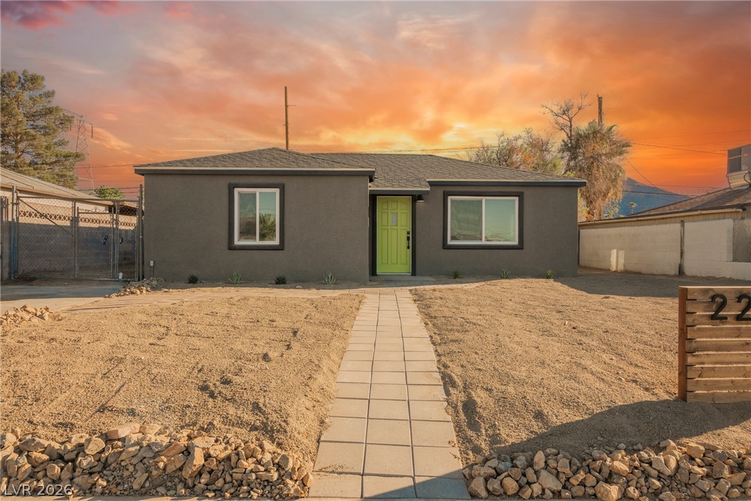 223 West Basic Road Henderson, NV 89015 - Photo 4 of 19 A paved path leads directly to the front entrance of this single-story stucco home.