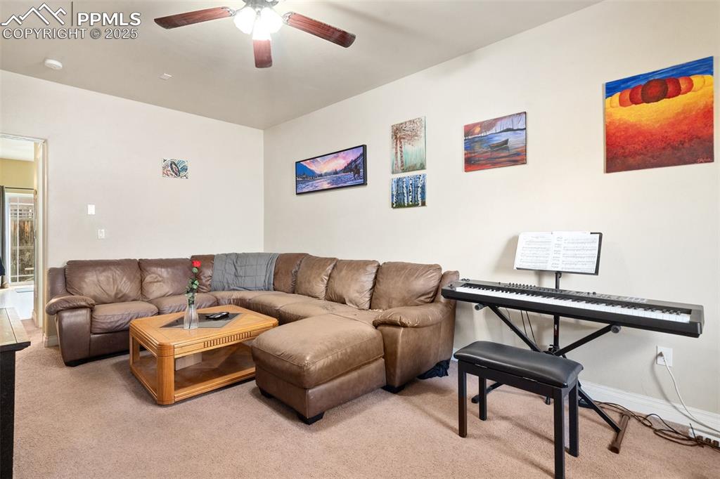 1510 York Road, Unit 101 Colorado Springs, CO 80918 - Photo 3 of 12 a living room with furniture and a ceiling fan