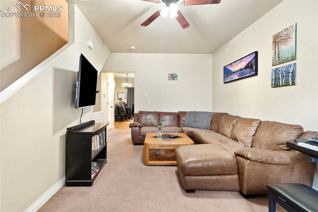1510 York Road, Unit 101 Colorado Springs, CO 80918 - Photo 4 of 12 a living room with furniture and a flat screen tv