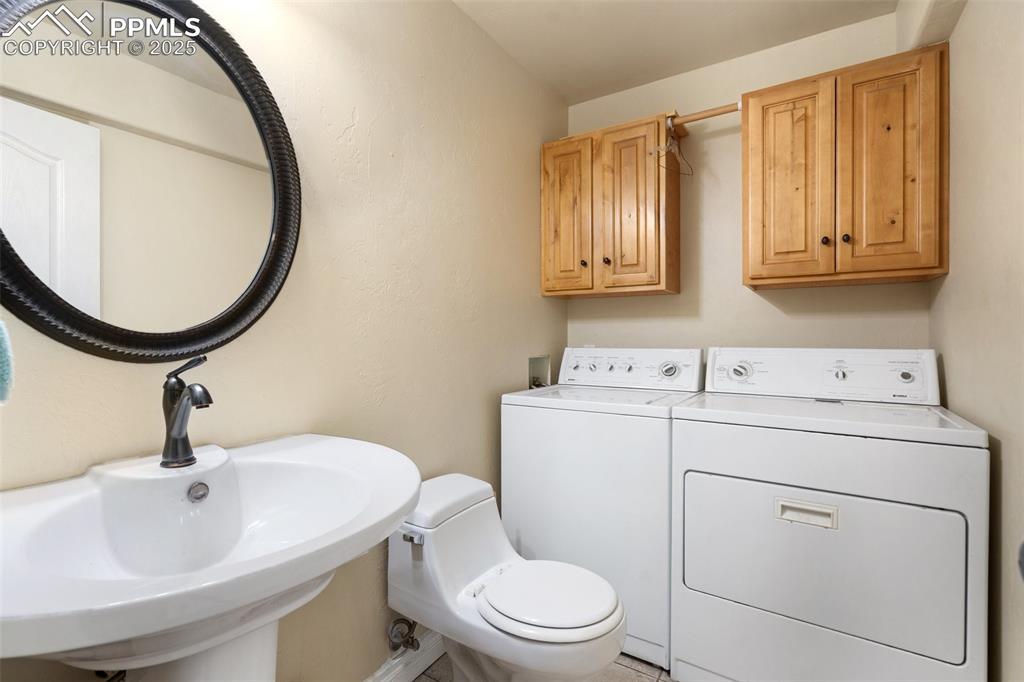 1510 York Road, Unit 101 Colorado Springs, CO 80918 - Photo 7 of 12 a bathroom with a sink a toilet and a mirror