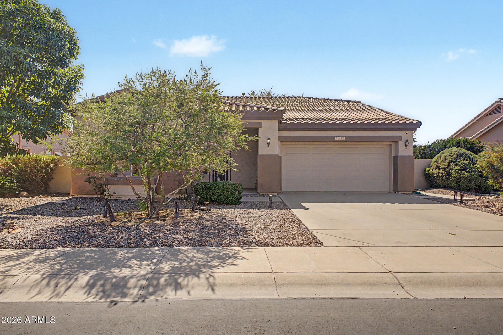 5090 South Ranger Trail Gilbert, AZ 85298 - Photo 2 of 50 a view of a house with a yard and plants