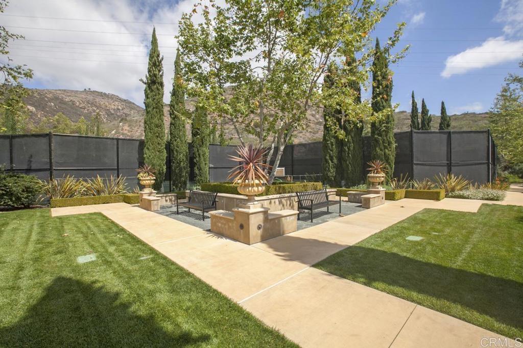 82 El Brazo Rancho Santa Fe, CA 92067 - Photo 19 of 23 a view of a swimming pool with a patio and a yard