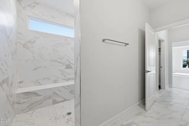 a bathroom with a bathtub and shower