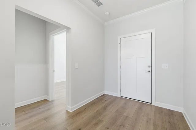 an empty room with wooden floor