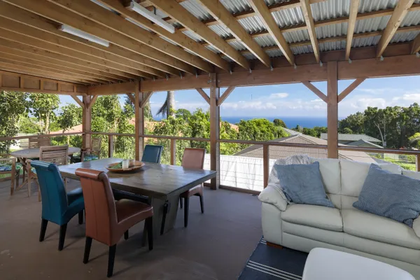 a view of a patio with a table and chairs