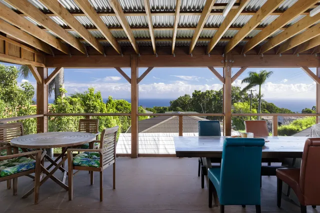 a view of a patio with a table and chairs