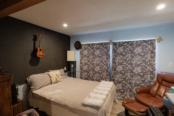 a bed room with a bed and a couch