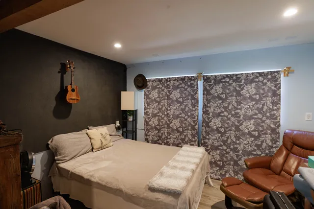 a bed room with a bed and a couch