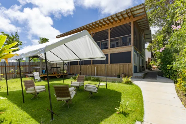 a patio with a table and chairs