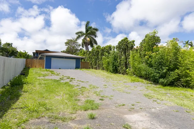 a living room with lots of furniture and a book shelf