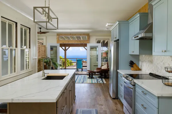 a kitchen with a sink stove and cabinets