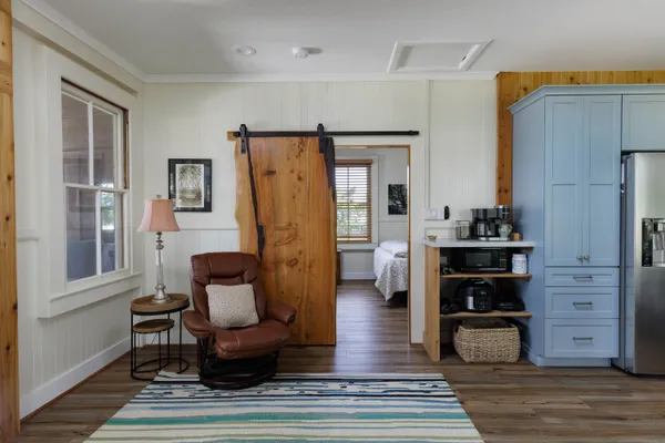 a living room with furniture and a rug