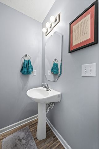 a bathroom with a sink mirror and vanity