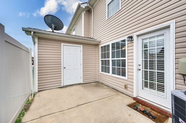 a view of an house with a door and balcony