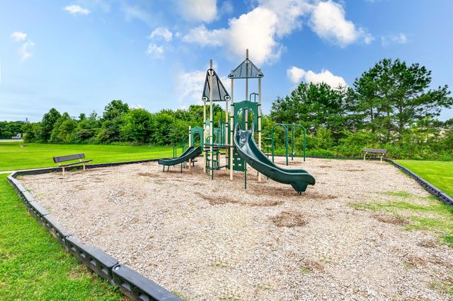 a view of a park with a slide