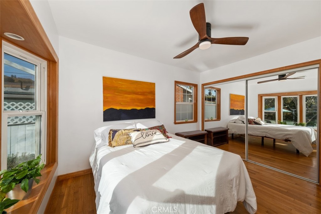 5117 Vincent Avenue Eagle Rock, CA 90041 - Photo 15 of 46 a bedroom with a bed and wooden floor