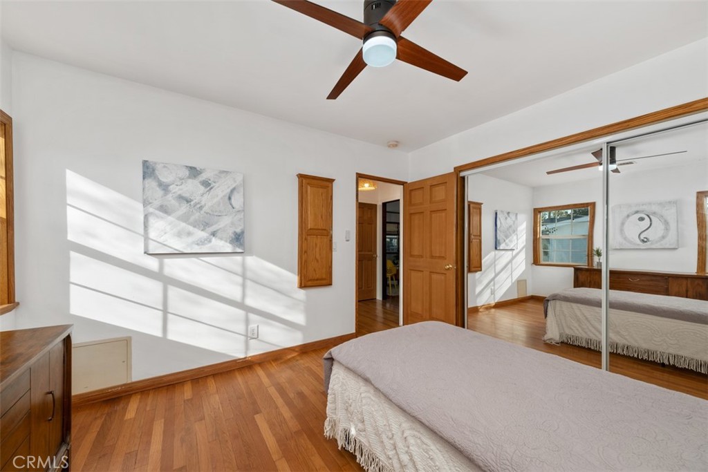 5117 Vincent Avenue Eagle Rock, CA 90041 - Photo 17 of 46 a bedroom with a bed and wooden floor