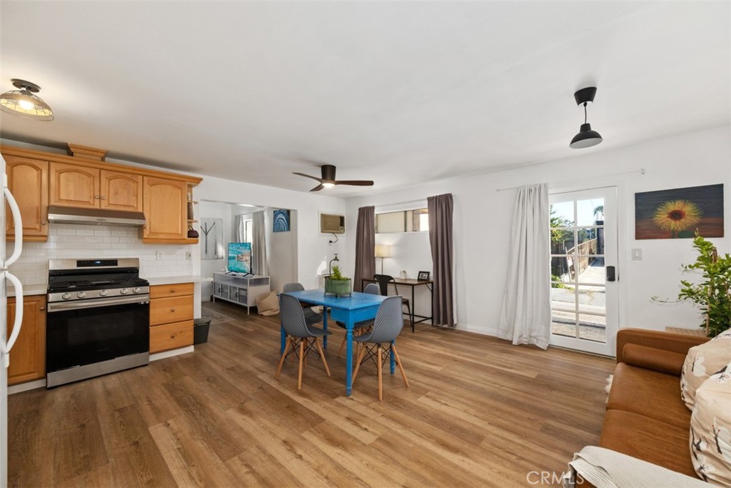 5117 Vincent Avenue Eagle Rock, CA 90041 - Photo 19 of 46 a view of a dining room with furniture window and wooden floor
