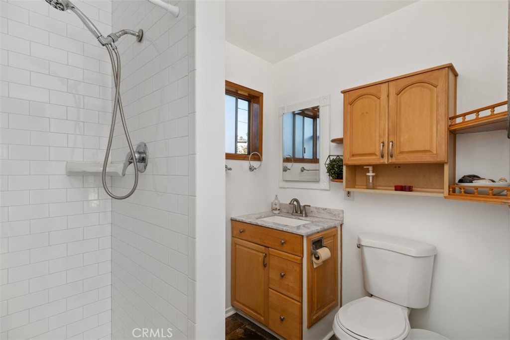 5117 Vincent Avenue Eagle Rock, CA 90041 - Photo 20 of 46 a bathroom with a toilet sink vanity tub and mirror