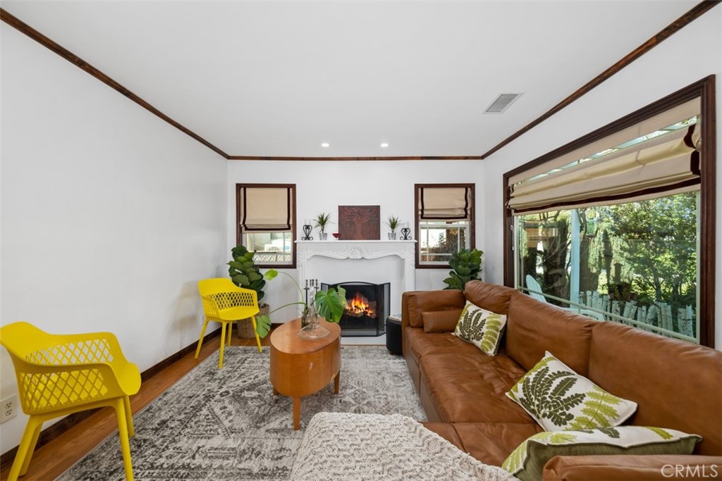 5117 Vincent Avenue Eagle Rock, CA 90041 - Photo 3 of 46 a living room with furniture a fireplace and a large window