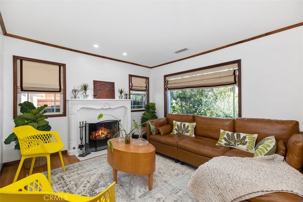 5117 Vincent Avenue Eagle Rock, CA 90041 - Photo 4 of 46 a living room with furniture fireplace and a large window