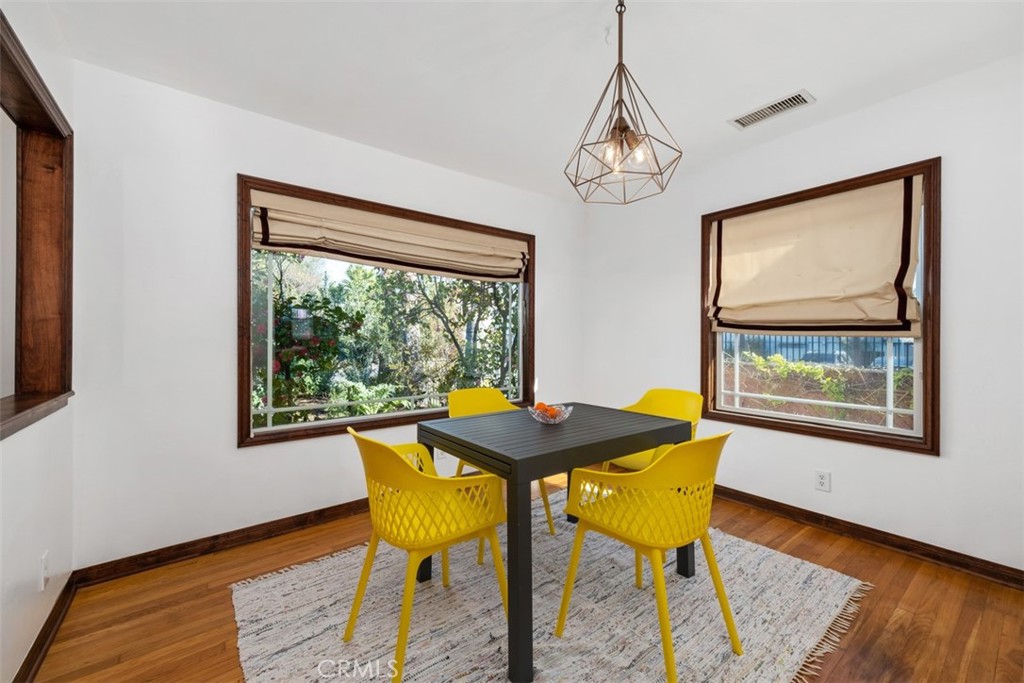5117 Vincent Avenue Eagle Rock, CA 90041 - Photo 6 of 46 a view of a dining room with furniture window and wooden floor