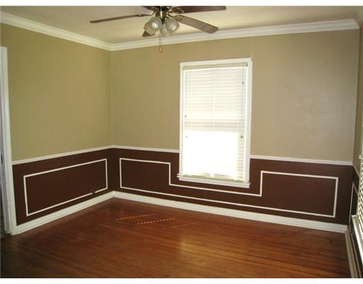 616 Sorrell Street Corpus Christi, TX 78404 - Photo 3 of 10 a view of an empty room with wooden floor and a window