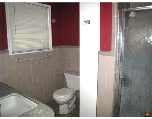 a bathroom with a toilet and a sink
