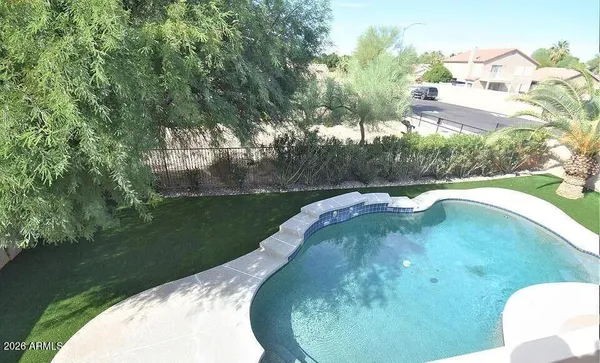 a view of a lake in middle of the house