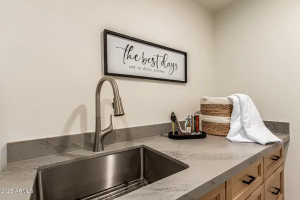 a kitchen with a washer and dryer