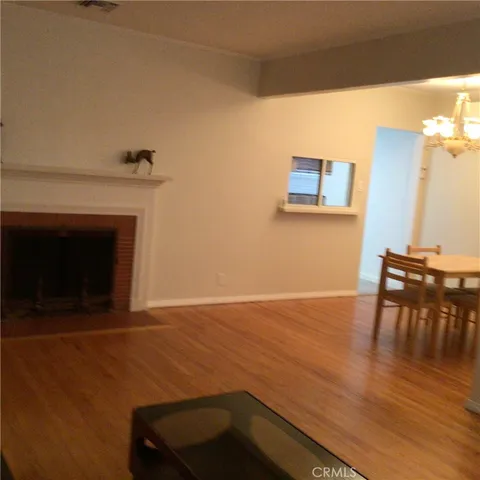 a view of livingroom with furniture and a fireplace