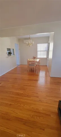 a dining room with a table and chairs