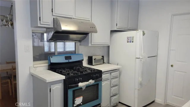 a kitchen with a sink and a window