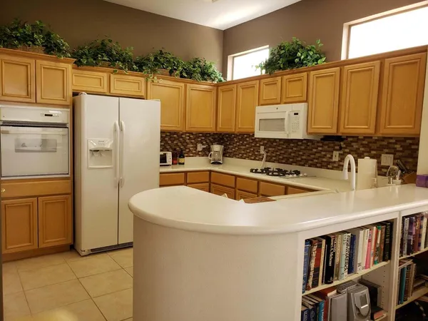 a bathroom with a sink a mirror and a shower
