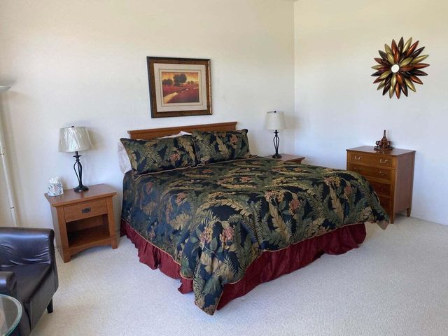 a bedroom with a bed and a table