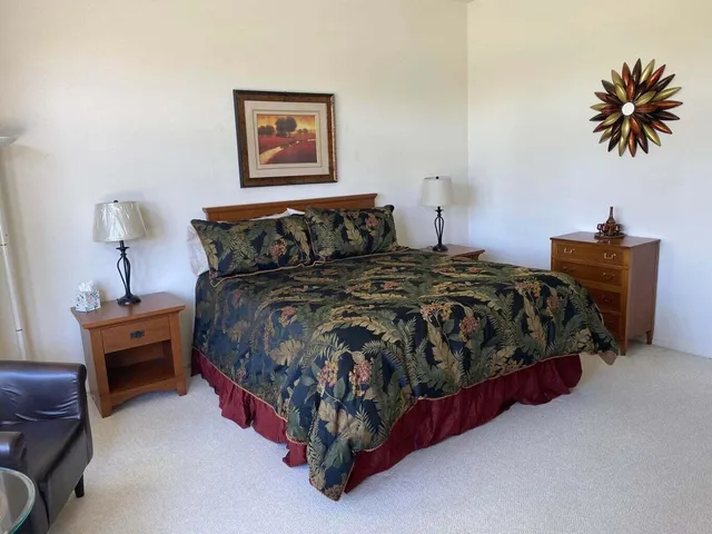 a bedroom with a bed and a table