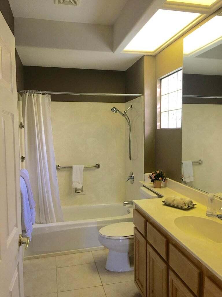 78786 Gorham Lane Palm Desert, CA 92211 - Photo 20 of 26 a bathroom with a granite countertop sink toilet and shower