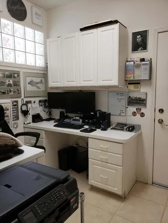 a kitchen with stainless steel appliances a stove a sink and a refrigerator
