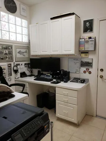 a kitchen with stainless steel appliances a stove a sink and a refrigerator