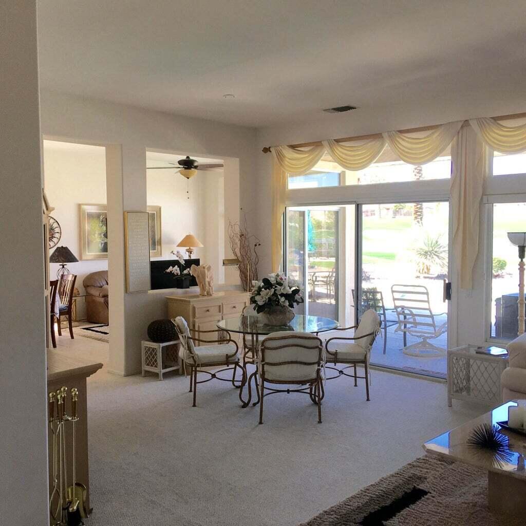 78786 Gorham Lane Palm Desert, CA 92211 - Photo 7 of 26 a living room with furniture and a floor to ceiling window