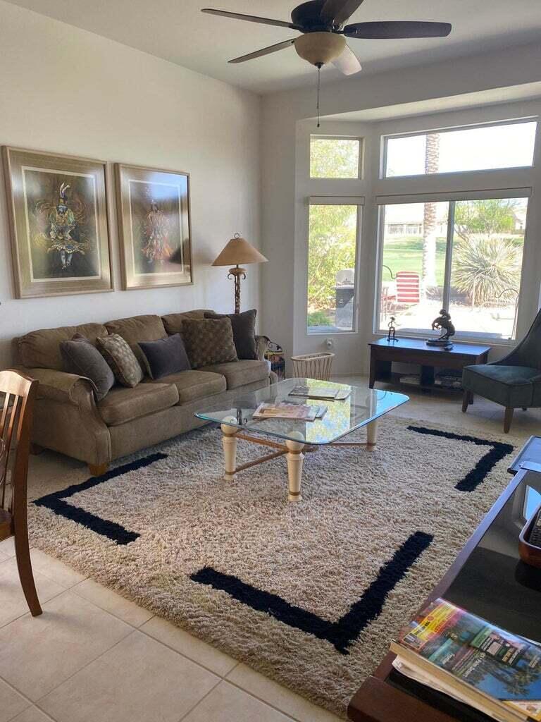 78786 Gorham Lane Palm Desert, CA 92211 - Photo 10 of 26 a living room with furniture and a window