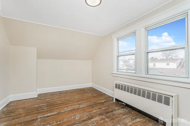 a view of an empty room with storage space