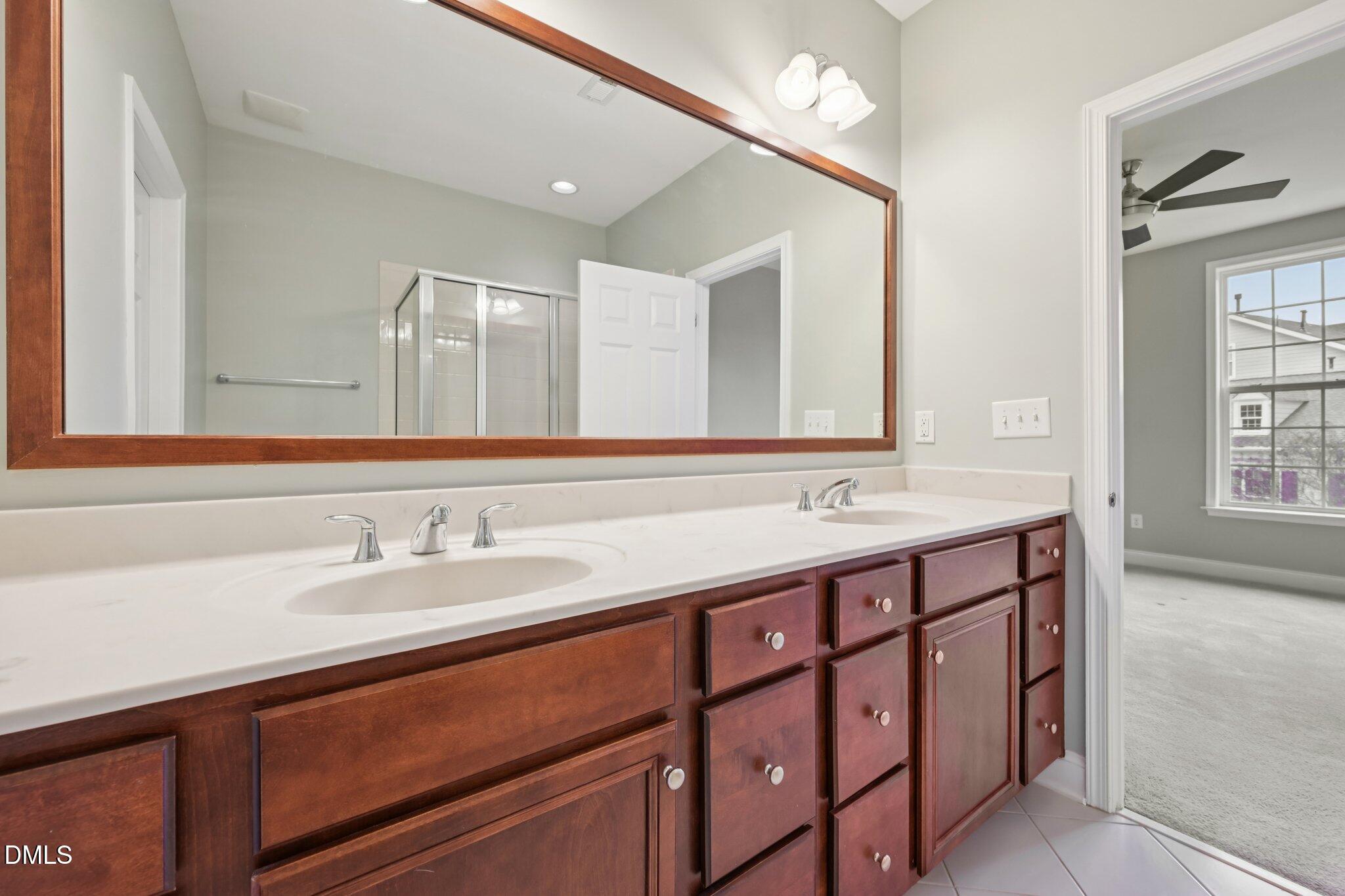 10510 Sablewood Drive, Unit 113 Raleigh, NC 27617 - Photo 27 of 38 a bathroom with a sink and a mirror