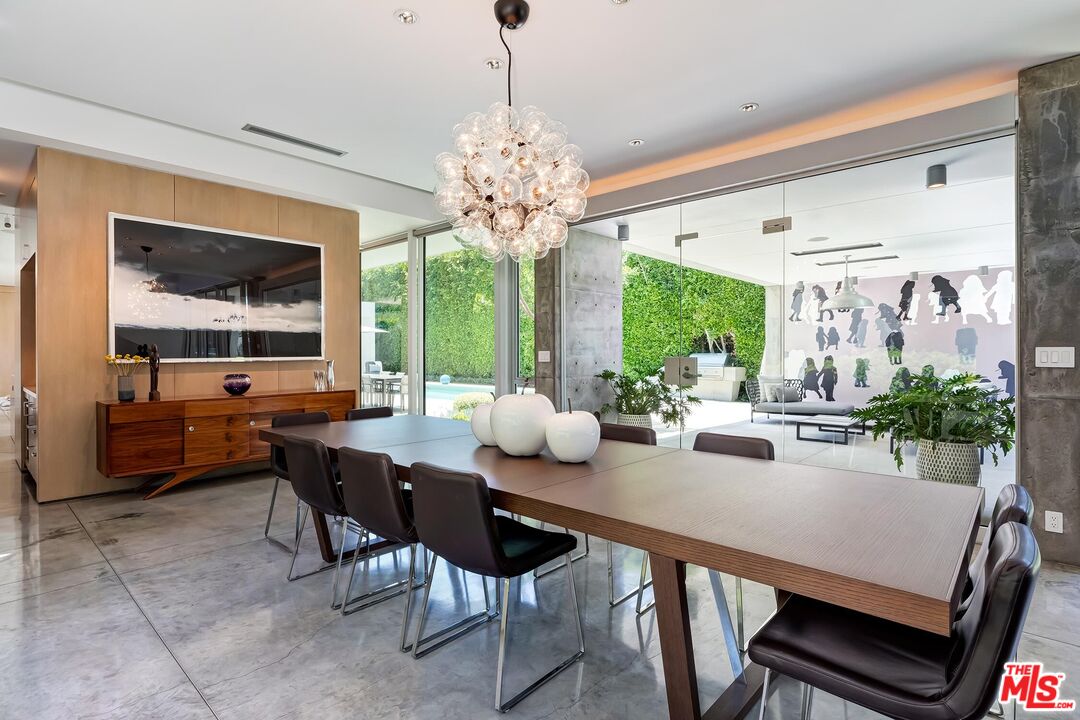 1342 Appleton Way Venice, CA 90291 - Photo 13 of 46 a view of a dining room with furniture large windows and wooden floor