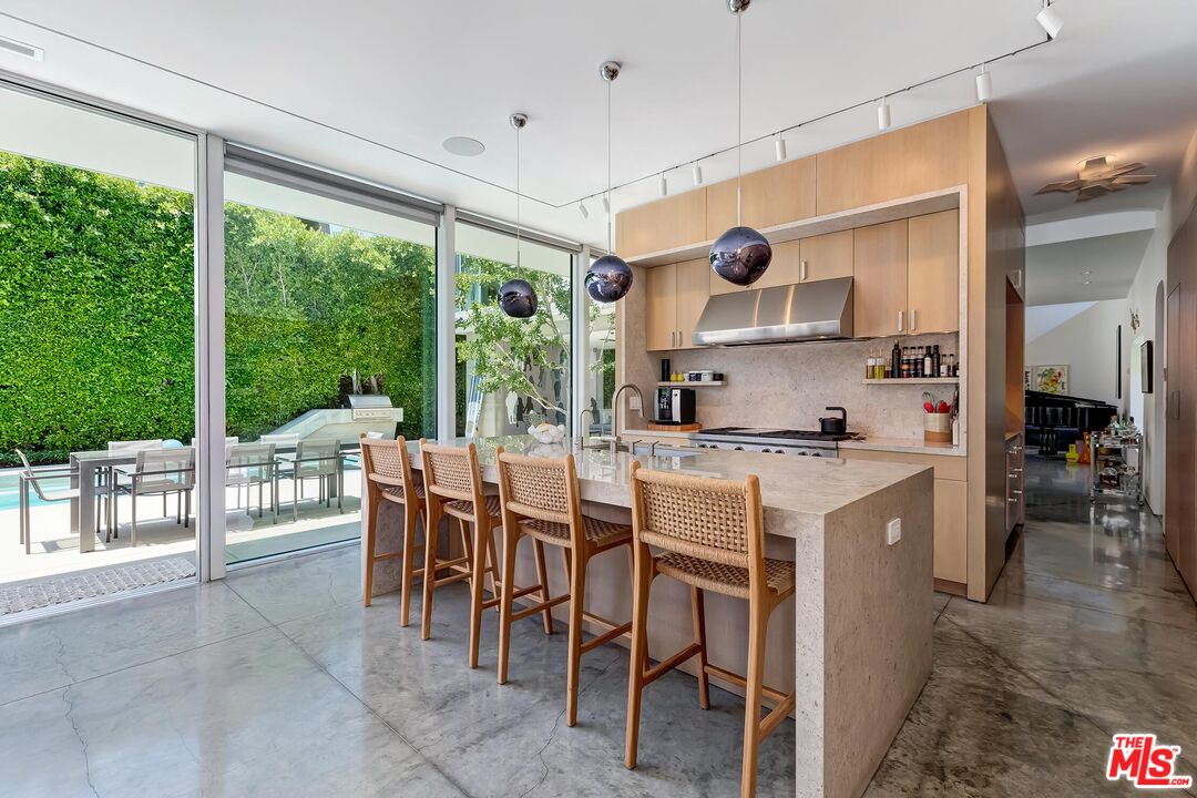 1342 Appleton Way Venice, CA 90291 - Photo 16 of 46 a kitchen with a table chairs stove and cabinets