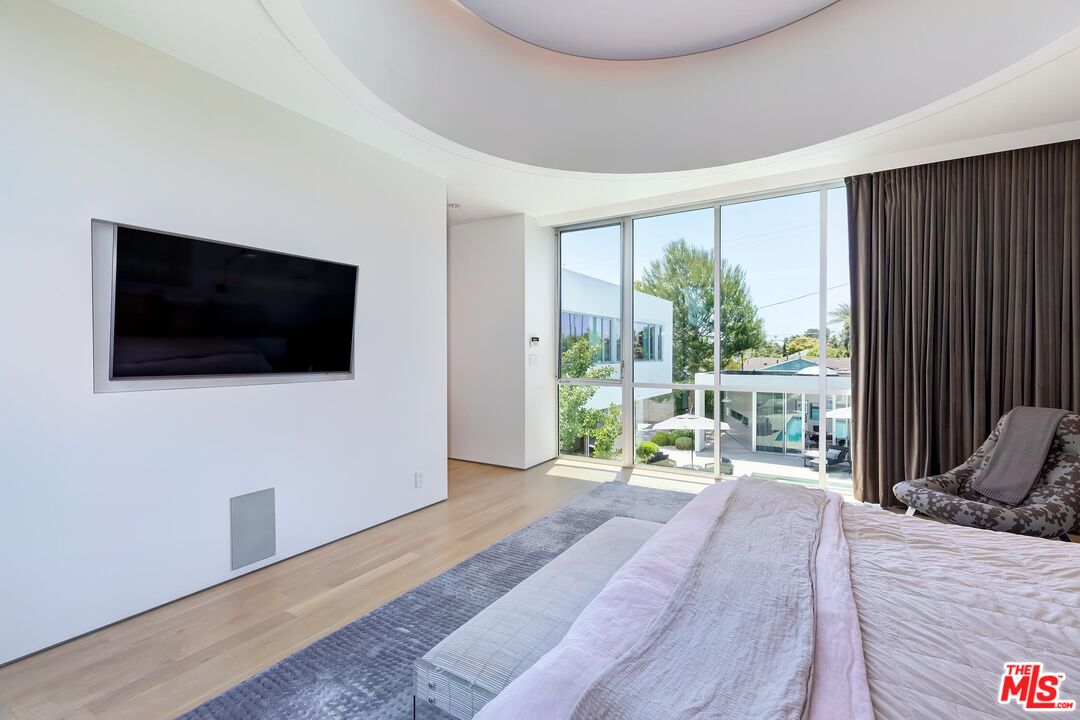 1342 Appleton Way Venice, CA 90291 - Photo 32 of 46 a bedroom with a bed and a flat screen tv