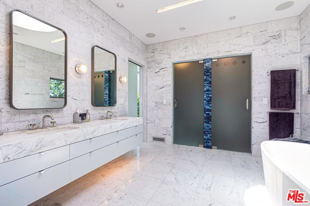 1342 Appleton Way Venice, CA 90291 - Photo 33 of 46 a spacious bathroom with a double vanity sink and a mirror
