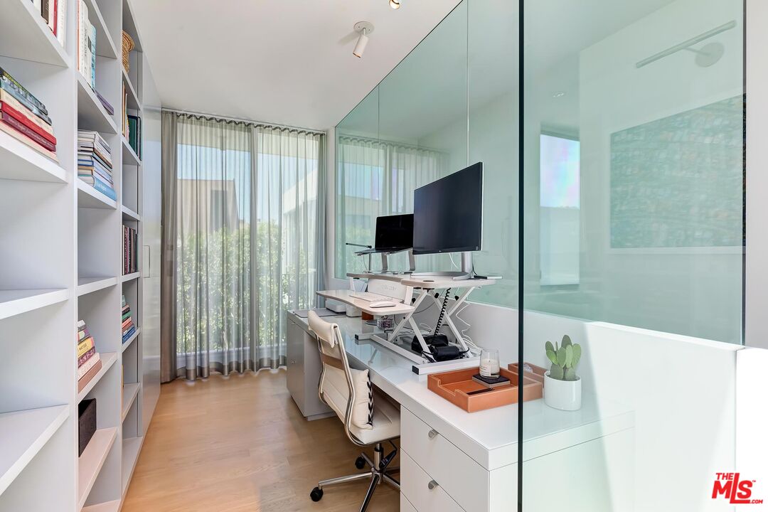 1342 Appleton Way Venice, CA 90291 - Photo 37 of 46 a view of a workspace with furniture and a flat screen tv