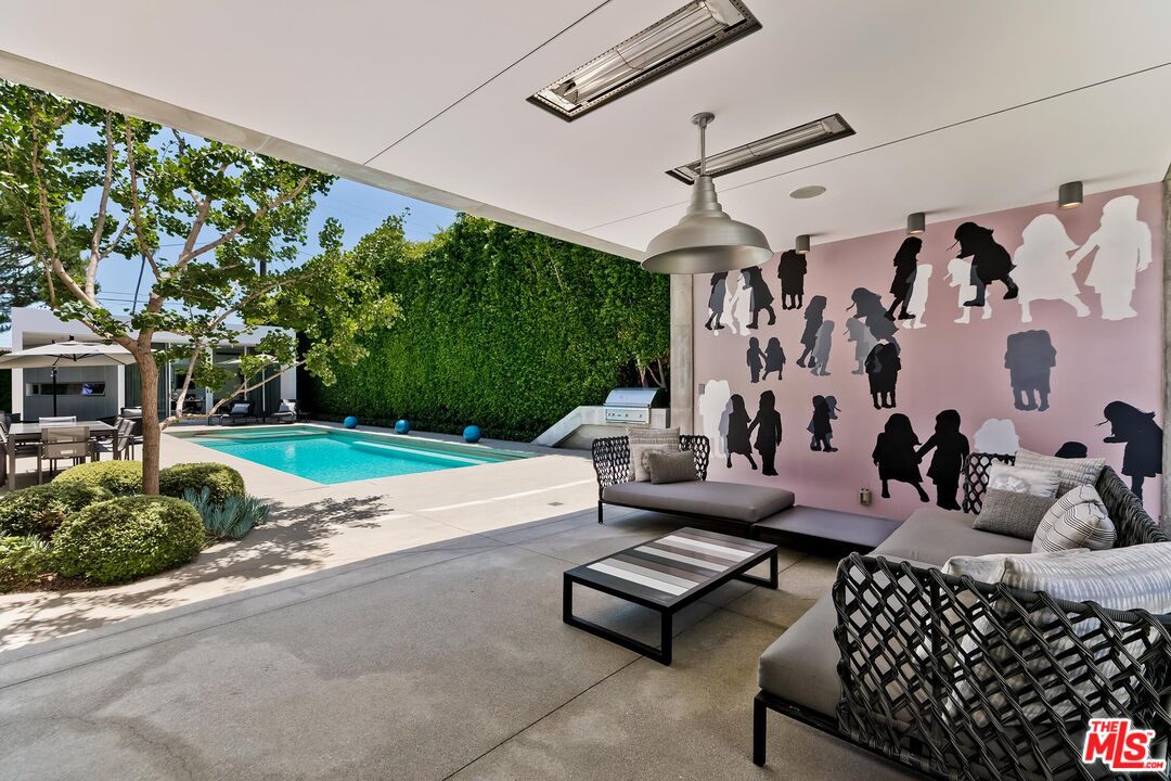 1342 Appleton Way Venice, CA 90291 - Photo 6 of 46 a living room with patio furniture and a fireplace