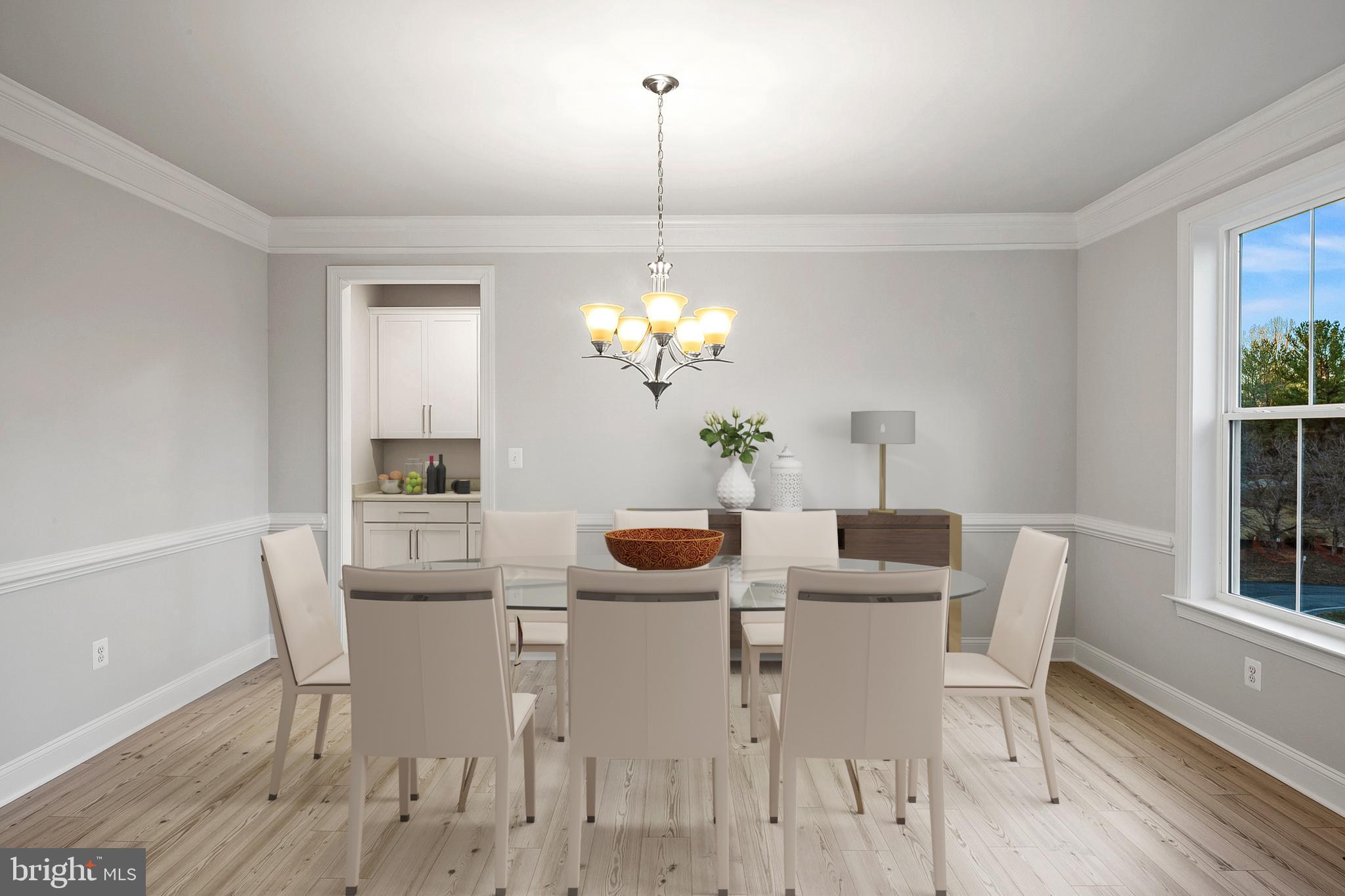 4496 Ilchester Road Ellicott City, MD 21043 - Photo 22 of 61 a dining room with furniture potted plants and wooden floor